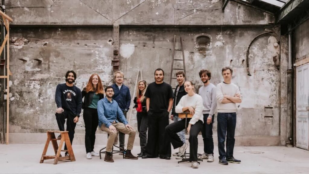 Group of people in industrial setting.